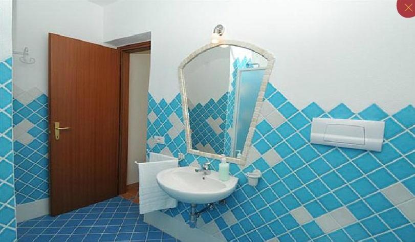 Gallo Spot a San Teodoro - B&B vicino a La Cinta