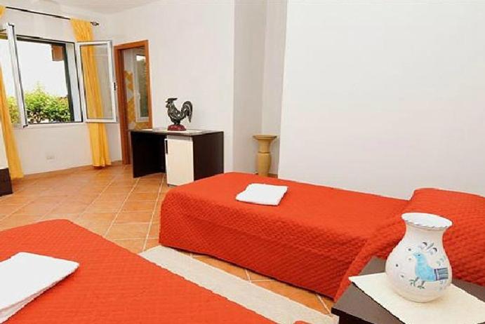 Gallo Spot a San Teodoro - B&B vicino a La Cinta