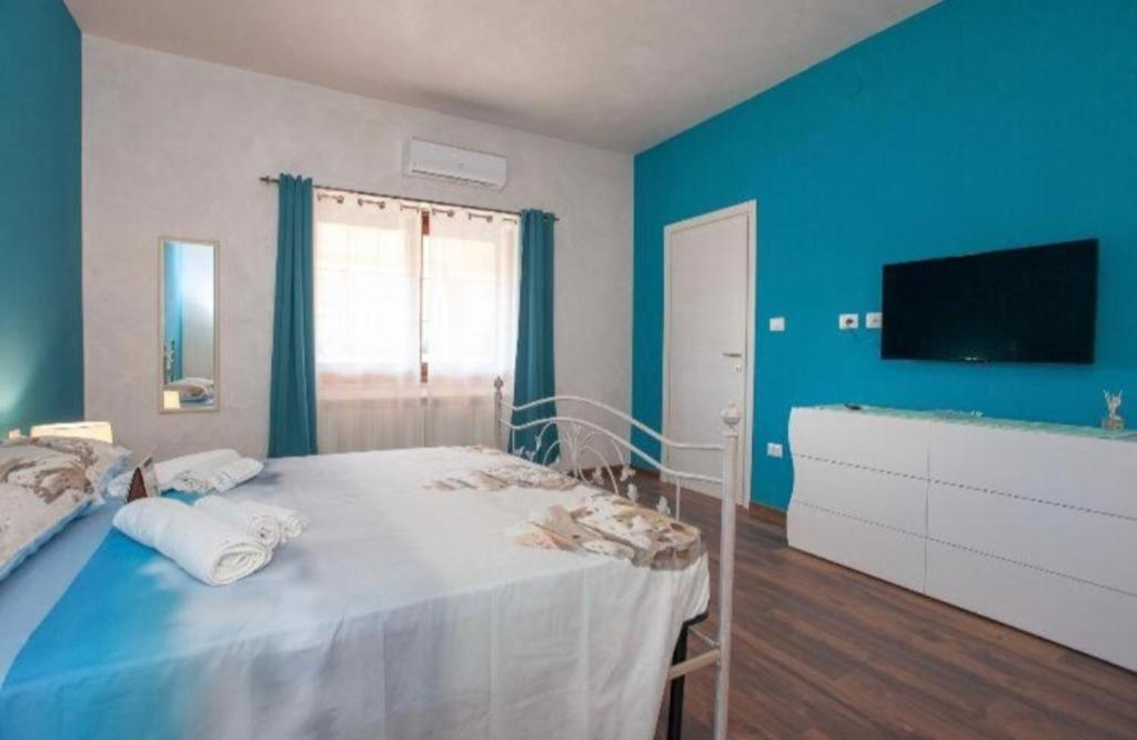 Da Claudietto a San Teodoro - Camere accoglienti in centro