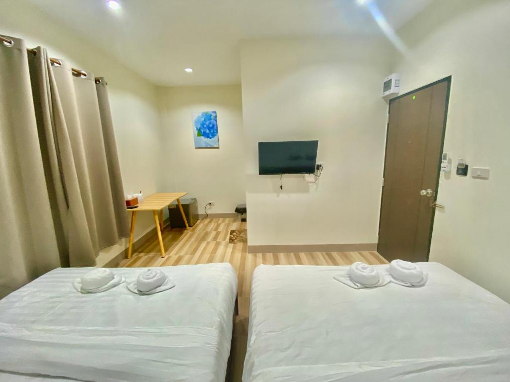 โรงแรมบ้านหมอบิวแก่งคุดคู้ - Deluxe Vierbettzimmer