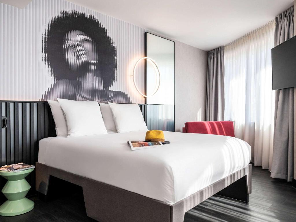 מיטה או מיטות בחדר ב-Tribe Amsterdam City