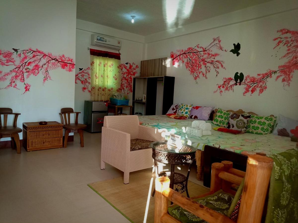 Cherry Blossom FAN ONLY Family Room at Casa Bolo- beach house, 15mins to Hundred Island - Housity