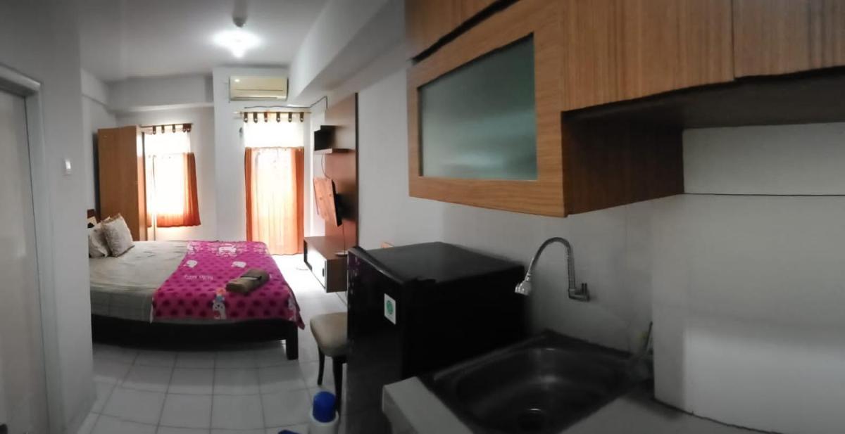 Suitetrails - Dramaga Tower Apartement Rendi Room