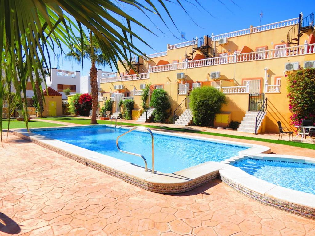 Suitetrails - Casa La Zenia Elite Townhouse with Shared Pool and 10 Minutes Walk to Beach