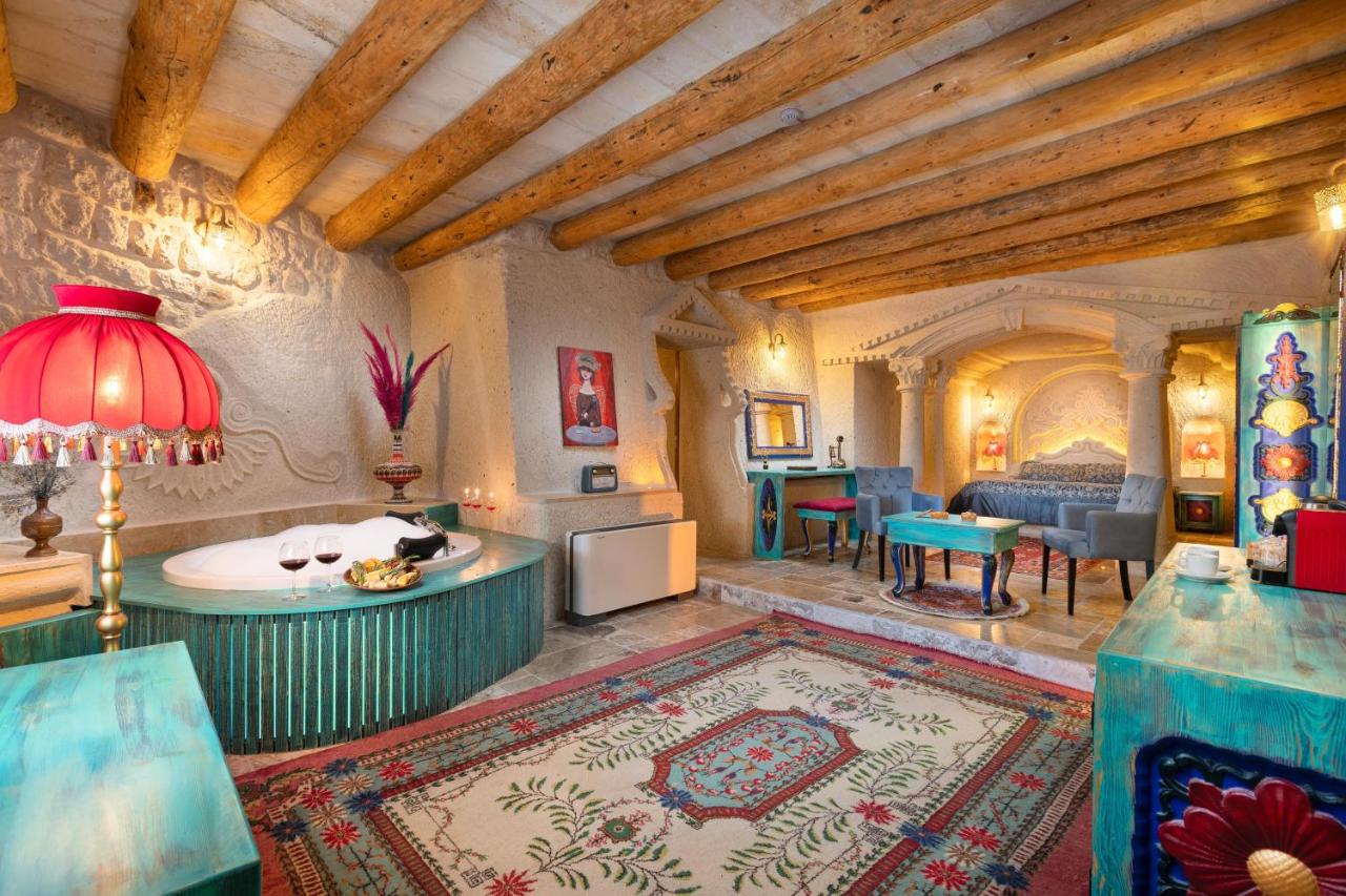 Elegant lobby with arched brick columns, colorful ceiling, and comfortable seating areas.