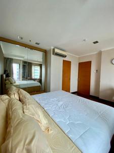 Tempat tidur dalam kamar di Hampton's Park C1-23H