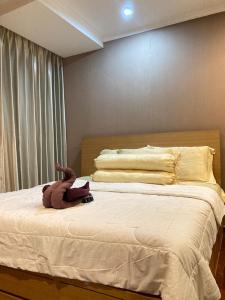 Tempat tidur dalam kamar di Hampton's Park C1-23H