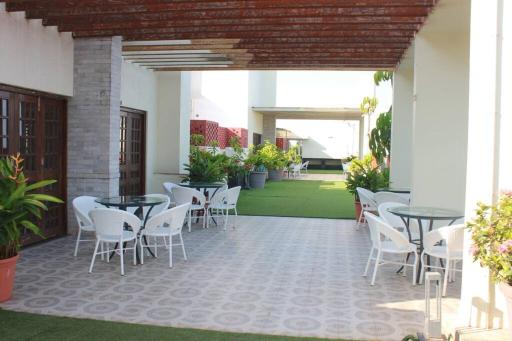 Pool front - 2 BHK Luxury Resort Homes by Zennova Stays - Housity